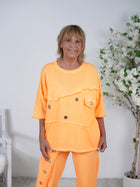 oversize Shirt mit ausgefransten Ärmeln und Ösen