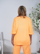 oversize Shirt mit ausgefransten Ärmeln und Ösen