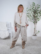 Poncho aus Leinen mit ausgefransten Abschlüssen Beige