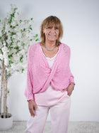 Strickponcho mit Twist