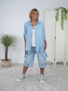 weite Bluse im Jeans Look mit Ösen verziert